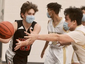 Stratford District secondary school's Ben Praseuth looks for a turnover against Goderich in the Huron-Perth senior boys' basketball opener Wednesday at SDSS. The Golden Bears won 77-31.