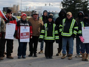 Unifor Local 914 members stand at the entrance to Clean Harbors on Monday November 22, 2021 in St. Clair Township, Ont. (Terry Bridge/Sarnia Observer)