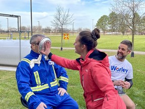 Sean Burke gets pie'd by Lauren Verwegen at Worley in Sarnia in support of the United Way employee campaign. Albert Kobe looks on knowing his turn is next. The employee campaign at Worley is wrapping up soon, and employees are encouraged to get their United Way contributions in to take advantage of the company match. United Way photo