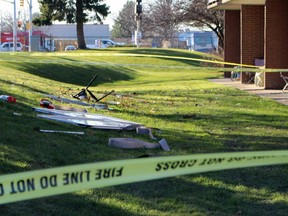 Debris, including patio doors, is scattered on the lawn outside a Finch Drive apartment building on Dec. 13, 2021, in Sarnia.  Terry Bridge/Sarnia Observer/Postmedia Network