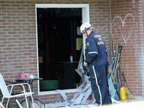 Clive Hubbard, an investigator with the Ontario Fire Marshal's Office, inspects the aftermath of an explosion inside a Finch Drive apartment on Tuesday, Dec. 14, 2021, in Sarnia.  (Terry Bridge/Sarnia Observer)