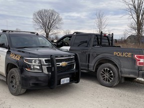 Two OPP cruisers are parked on Gum Bed Line near Crooked Road on Thursday, December 30, 2021 in Enniskillen Township as the investigation into two deaths continues.  Terry Bridge / Sarnia Observer / Postmedia Network PHOTO BY TERRY BRIDGE / Terry Bridge / The Observer