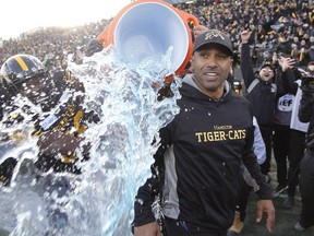 Hamilton Tiger-Cats head coach Orlondo Steinauer is doused with ice water after defeating the Edmonton Eskimos during the East final at Tim Hortons Field. John E. Sokolowski-USA TODAY Sports