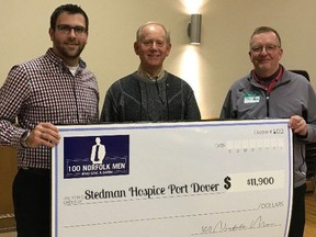 100 Norfolk Men Who Give A Damn co-founders Alan Duthie, left, and Phil Race, right, present a cheque to Ross Gowan of the Stedman Community Hospice-Norfolk Outreach Program. The hospice is one of several non-profit organizations to benefit from donations from 100 Norfolk Men Who Give A Damn over the past five years. CONTRIBUTED