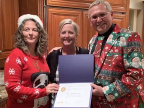 Tracy Winkworth, centre, was presented with a Paul Harris Fellow award recently from the Rotary Club of Norfolk Sunrise for her contribution to the service club and the community. Club president Louise Schebesch, right, and past president Steve Malo made the presentation. CONTRIBUTED PHOTO