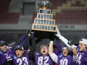 Western Mustangs players celebrate after winning the Vanier Cup over Saskatchewan in Quebec City on Saturday Dec. 4, 2021. Twitter.com/ @westernmustangs