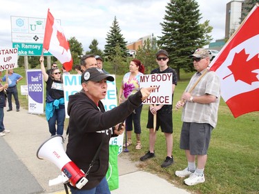 Protesters take part in a rally against vaccine passports and vaccine mandates on Paris Street near Health Sciences North on Sept. 13. Close to 50 people participated in the event. John Lappa/Sudbury Star