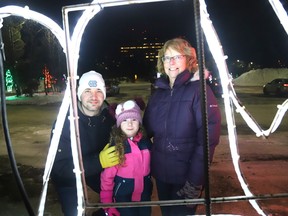 Andrew McKillop and his daughter, Ella, 5, and her grandmother, Lorie McKillop, check out the Festival of Lights at Science North in Sudbury, Ont. The Festival of Lights, which is open seven days a week starting at 5 p.m., is presented by the Sudbury Charities Foundation and sponsored by the science centre. John Lappa/Sudbury Star/Postmedia Network