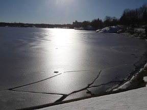 The sun reflects off the ice-cracked surface of Ramsey Lake in Sudbury, Ont.