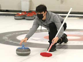 Skip Kody Nowe, of Confederation Chargers, throws a rock during high school curling action against Champlain Requins at Curl Sudbury in Sudbury, Ont. on Tuesday December 14, 2021. John Lappa/Sudbury Star/Postmedia Network
