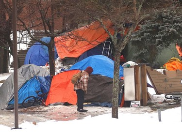 Residents of a tent city in Memorial Park continued to tough it out in December, even as snow descended and temperatures plummeted. John Lappa/Sudbury Star