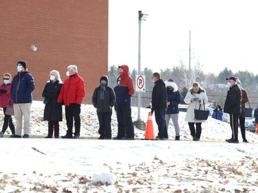 People wait in line at a vaccination clinic at the Garson arena on Dec. 21 as concerns mounted regarding the spread of the Omicron variant. John Lappa/Sudbury Star