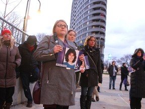 Carly McClughan, with the Sexual Assault Survivors' Centre of Sarnia-Lambton, holds a photo of one of the women killed during the 1989 Montreal massacre. Paul Morden/Postmedia