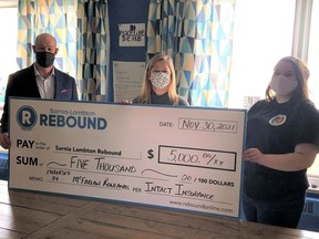 Local insurance broker McFarlan Rowlands provided Sarnia-Lambton Rebound with a $5,000 cheque to help support The HUB. The money came from Intact Insurance's Better Communities Program. From left are McFarlan Rowlands branch manager Craig Musico, Rebound executive director Carrie McEachran and The Hub program co-ordinator Kristen Clendenning. Handout/Sarnia This Week