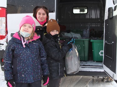 Jaden Girard, from left, Jemma Girard and Miley St-Jean dropped off a bag of non-perishable food items for the South Porcupine Food Bank during the Holiday Fun Day hosted by Downtown Timmins Saturday afternoon.

RON GRECH/The Daily Press