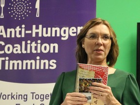 Helen Yaschyshyn, of the Timmins Multicultural Society, displays a copy of a newly released community cookbook, 'Taste of Timmins: Bon Appetit!' The launch was held Friday at the Timmins Museum.

ANDREW AUTIO/The Daily Press