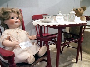 This piece in the All We Wanted for Christmas exhibit at Annandale National Historic Site includes a porcelain doll, child's table and doll dishes (circa 1920s) from the museum's permanent collection and a teddy bear (circa 1910s). (Chris Abbott/Norfolk and Tillsonburg News)