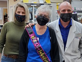 Yvette Larabee (middle) was giving a fond farewell by Amanda and Frank Louvelle with balloons, a sash and gifts from the staff. Times-Post photo by Debbie Morin.