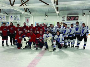 The Guns N' Hoses and County Central High School Hawks after the fourth annual Challenge Cup, held Dec. 15 at the Vulcan District Arena.