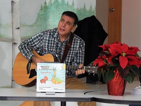 Walpole Island educator, musician and author Edwin Taylor performs his song The Bug and The Slug (Mnidoosh Miinwaa E-Zhaash'Sid) during his book launch at the Bkejwanong First Nation Public Library on Dec. 4. Carl Hnatyshyn/Sarnia This Week