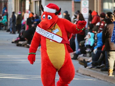 This dragon was of the friendly variety, waving at the crowd Sunday during Woodstock's Santa Claus Parade.
BRUCE URQUHART/SENTINEL-REVIEW