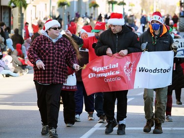 Athletes with the Woodstock Special Olympics marched through the downtown during Sunday's Santa Claus Parade.
BRUCE URQUHART/SENTINEL-REVIEW