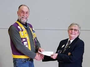 Betty Scott, the chair of the poppy campaign for the Beachville branch of the Royal Canadian Legion, accepts a donation from Don Taylor, a member of the Sweaburg Lions Club.
SUBMITTED PHOTO