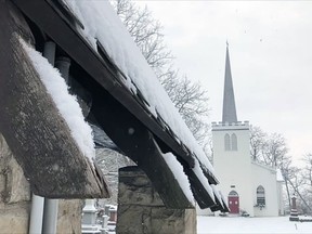 Although there's rain in the forecast for Saturday, Old St. Thomas Church wears a mantle of White Christmas snow in a screenshot from a 2021 Christmas carol-sing video made earlier this month and posted online.(Catherine and Andre Villar)