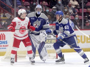Soo Greyhounds forward Justin Cloutier and Sudbury Wolves defenseman Liam Ross in first period action at the GFL Memorial Gardens on Dec. 29. Cloutier scored his fourth goal of the season early in the first period, the Greyhounds winning 4-2 in Sudbury on Sunday afternoon.