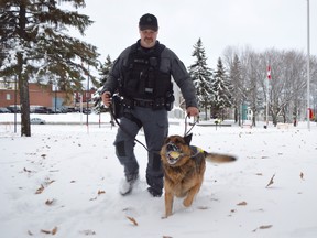 Greater Sudbury Police Sgt. Doug Ward plays with Scout in late 2018, shortly before the canine’s retirement.
