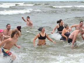 Dozens took part in a polar bear dip at Southampton, Ontario, on Saturday, January 1, 2022.