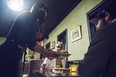 A server brings food to hungry diners at Birdy's Fine Casual Dining on the last day before a province-wide shutdown beings which will see the halting of in-restaurant dining for three weeks. Tuesday in Belleville, Ontario. ALEX FILIPE