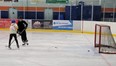 Two hockey players playing drop-in shinny on Jan. 4 at the Bob Snodgrass Recreation Complex.