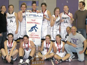 Ken Hamilton (far right) celebrates a St. Basil Secondary gold medal win at an OFSAA AA tournament. SUPPLIED