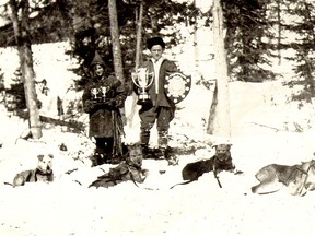Billy and Molly Martin pose with their winning sled dog team and trophies, including the A. R. Globe Shield, awarded to the winner of the Porcupine Dog Race in 1920. SUBMITTED PHOTO