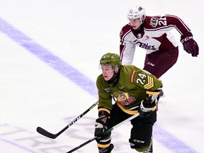 Ty Nelson of the North Bay Battalion carries the puck away from Jaden Reyers of the Peterborough Petes in Ontario Hockey League action. Nelson leads five members of the Battalion in midseason rankings prepared by the National Hockey Leagues central scouting department.
Sean Ryan Photo