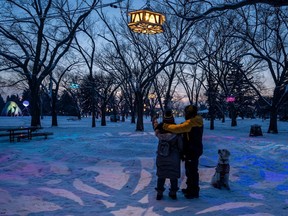 A couple marvels at the creations lighting up Borden Park during the annual Deep Freeze festival, celebrating its 15th anniversary this year from Jan. 14-23.