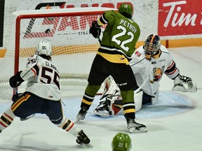 Matvey Petrov of the North Bay Battalion scores in the first period of Ontario Hockey League action Sunday against the visiting Barrie Colts. Brandt Clarke is late on the scene to help goaltender Mack Guzda.
Sean Ryan Photo