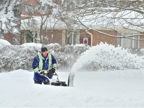 A heavy winter storm Sunday put most all snow blowers in Norfolk County to the test Monday morning. Among those clearing the sidewalk in front of their home in Port Dover was Alex Wilkinson, of Main Street. – Monte Sonnenberg