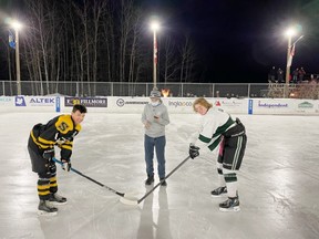 Robin Hood’s Derek Brown drops the puck for a charity exhibition game between the U-16 AA Sherwood Park Senators and Strathcona Warriors at Saiker’s Acres last Sunday. Photo by Supplied