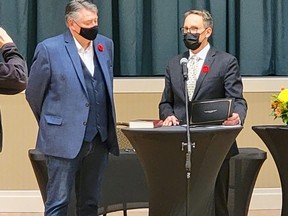 Senator Scott Tannas (left) and Mayor Craig Snodgrass (right) during his Swearing in Ceremony on Oct. 25 at the Highwood Memorial Centre.