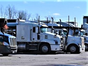 A large convoy of transport trucks, as seen in this Intelligencer file photo, will converge on the nation’s capital Saturday to rally against new federal government rules that mandated two COVID-19 vaccines for truck drivers to enter Canada effective Jan. 15. DEREK BALDWIN FILE