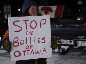 Michel Blais joins vaccine mandate opponents Thursday evening at Flying J Travel on Great Northern Road in Sault Ste. Marie, awaiting Convoy for Freedom 2022. JEFFREY OUGLER/POSTMEDIA