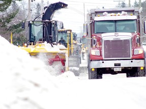 Sault Ste. Marie's public works crews are starting to remove snowbanks on the sides of main streets. Driver's are asked to use caution near the large equipment.   SAULT STAR FILE PHOTO