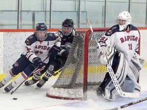 French River Rapids forward Cooper Bowman (27) carries the puck past netminder Ben Montgomery (31) while Espanola Express forward Gavin Graham (2) gives chase during first-period NOJHL action at Noelville Community Centre on Tuesday, February 23, 2021.