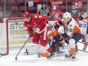 Soo Greyhounds defenceman Jack Thompson skating through the Flint Firebirds slot during the first period of OHL action at the GFL Memorial Gardens on Friday night. The Hounds dropped a 5-4 overtime decision to the Firebirds.