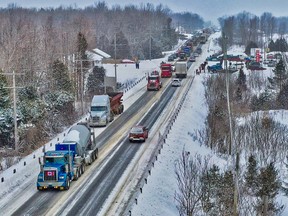 Trucks head south from Owen Sound along Highway 6/10 on Friday morning as part of a protest against vaccine mandates.
(Photo courtesy @greybrucedrone)