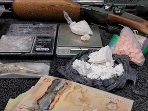 Various forms of cocaine, digital scales, cash, firearm ammunition and a 12-gauge shotgun were seized during a drug warrant execution on Boundary Street in Prescott last Thursday. A Kingston man and five others were arrested during the search.