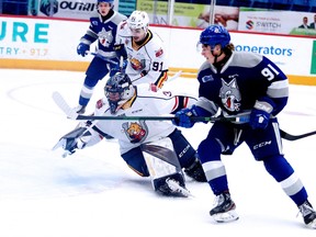 Evan Konyen of the Sudbury Wolves, looks for the loose puck in front of Barrie Colts goalie Matteo Lalama during OHL action from the Sudbury Community Arena on Sunday afternoon. The Wolves defeated the Colts 6-5.