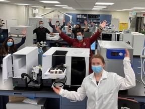 Cambrian College’s R&D team celebrates in one of the research labs at the main campus. In the latest national rankings, the college placed 18th for research activity among colleges.
